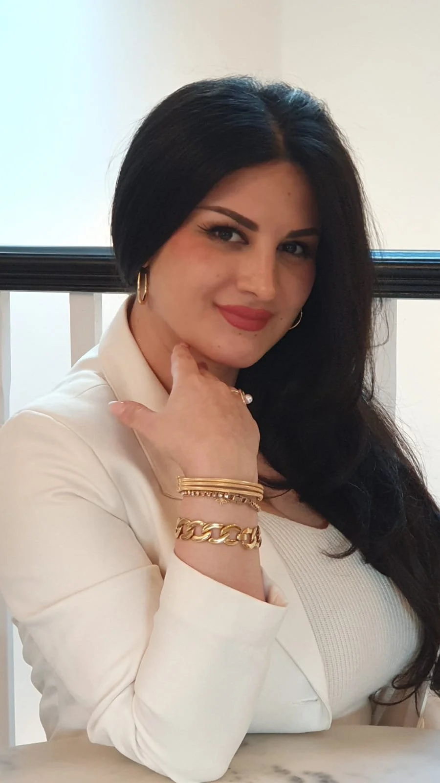 Lama Abou Daher in an ivory blazer